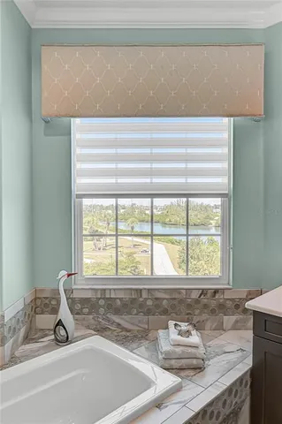 a view of a lake with houses in the back