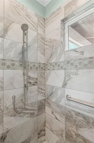 a view of a house with a yard and potted plants