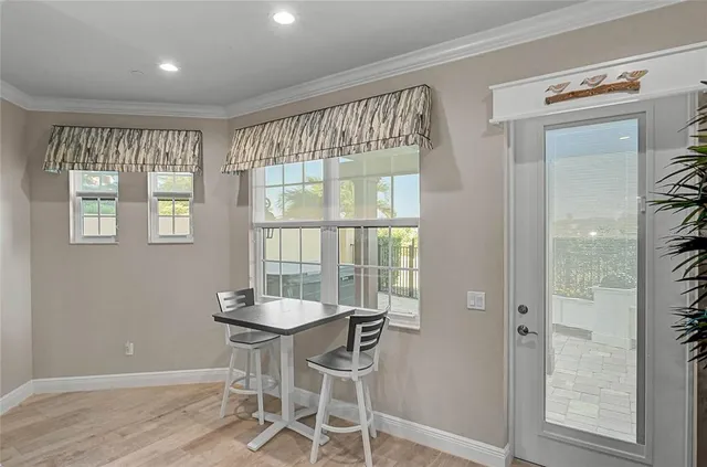 a view of a dining room with furniture window and outside view