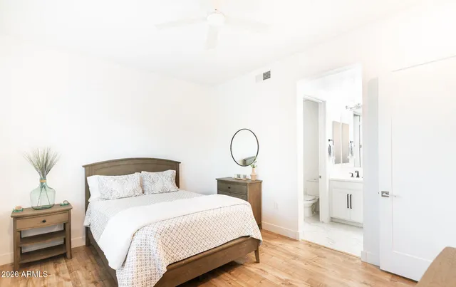 a bedroom with a bed and a cabinets