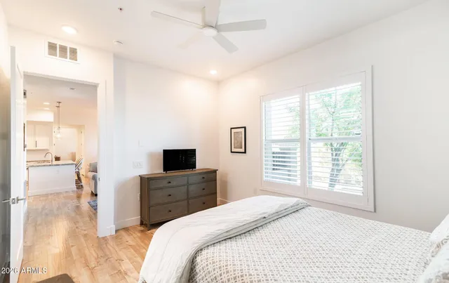 a bedroom with a bed and a television