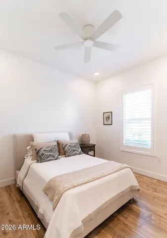 a bedroom with a bed and a window