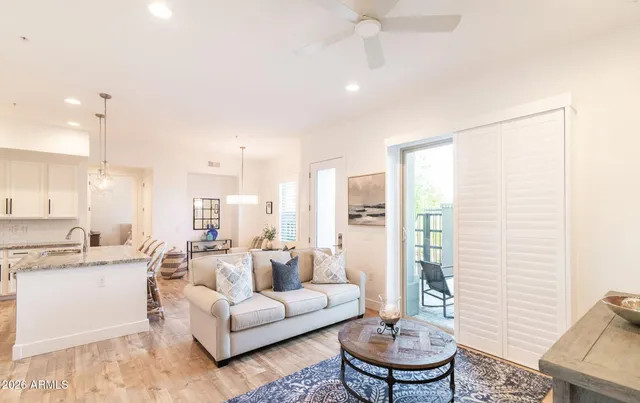 a living room with furniture and a large window
