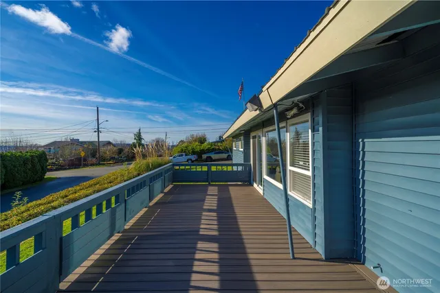 a view of balcony with wooden floor