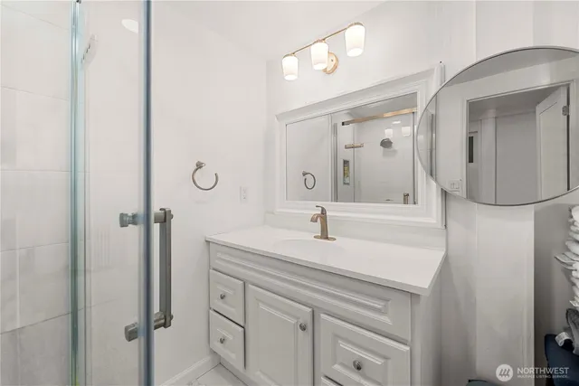 a bathroom with a double vanity sink and a mirror