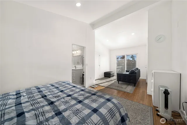 a bedroom with a bed and a couch