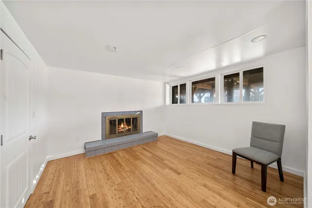 a bedroom with a bed and a chair