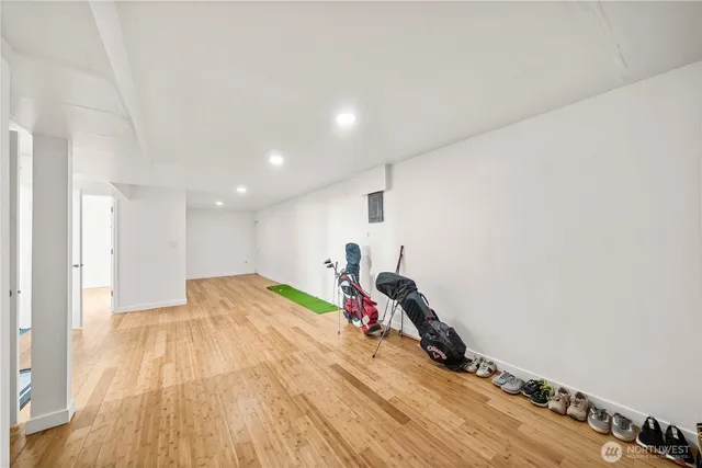 a view of a room with wooden floor and stairs