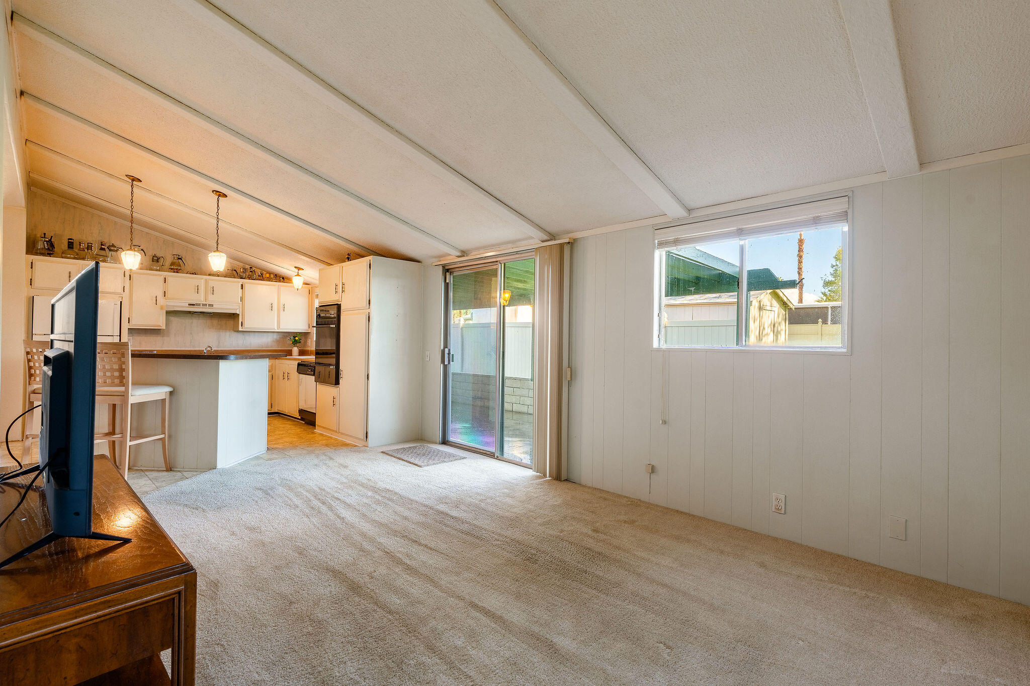 149 Capri Street Rancho Mirage, CA 92270 - Photo 19 of 50 a view of a kitchen with refrigerator and wooden floor