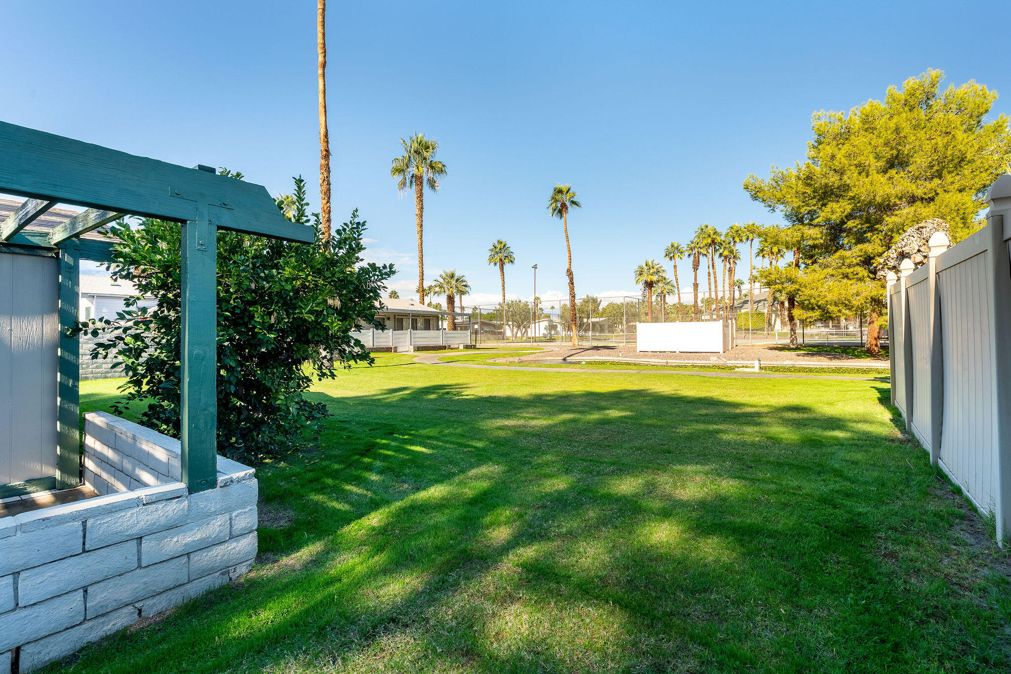 149 Capri Street Rancho Mirage, CA 92270 - Photo 2 of 50 a view of a garden with a fountain