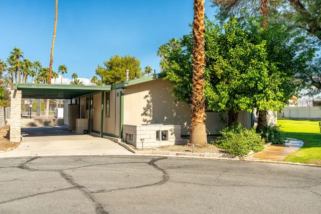 a view of a house with outdoor space and sitting area