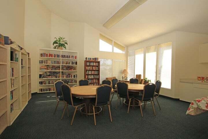 149 Capri Street Rancho Mirage, CA 92270 - Photo 42 of 50 a dining room with furniture and a floor to ceiling window