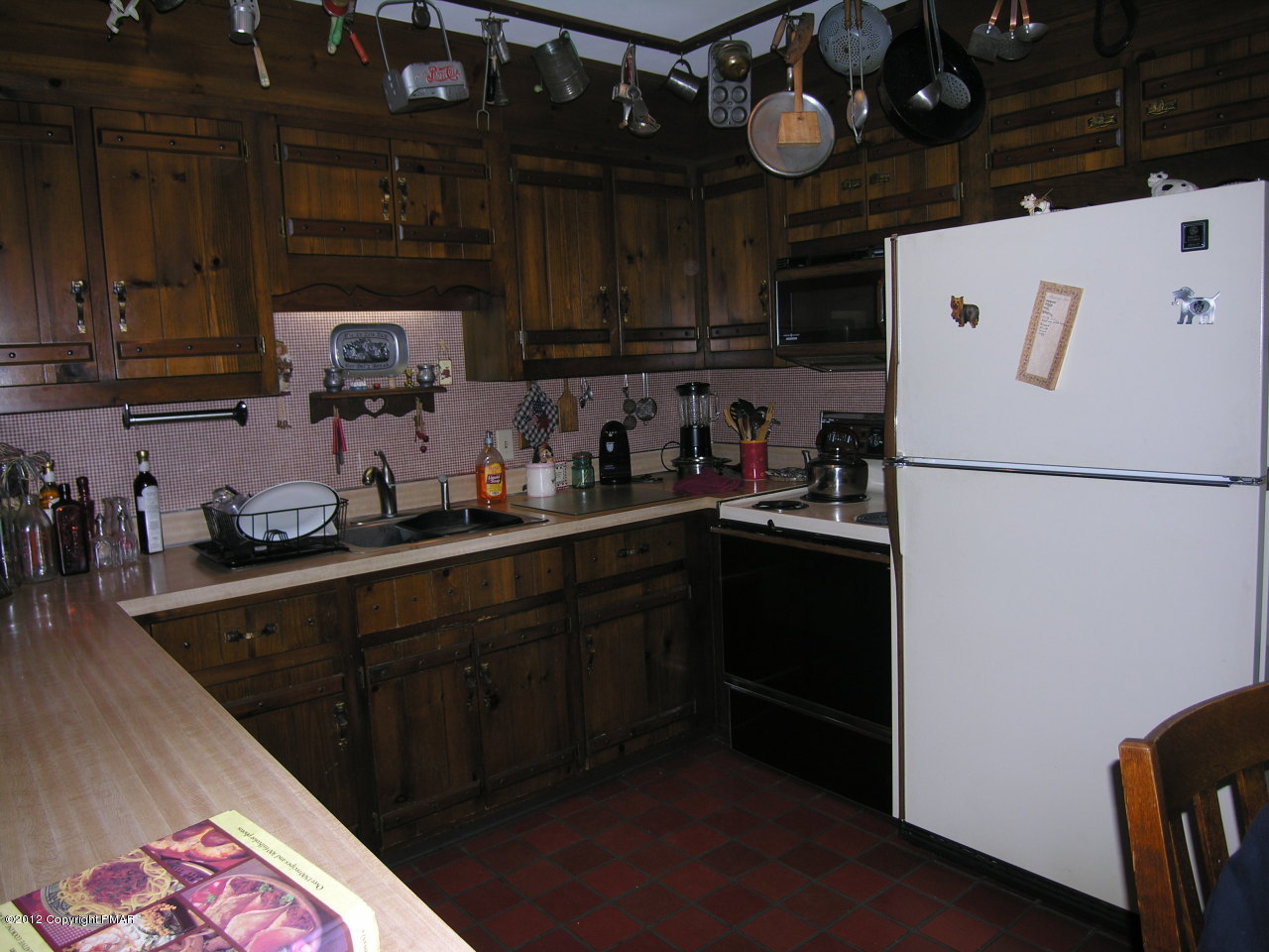 5720 Neola Road Stroudsburg, PA 18360 - Photo 11 of 16 a kitchen with a refrigerator and a sink