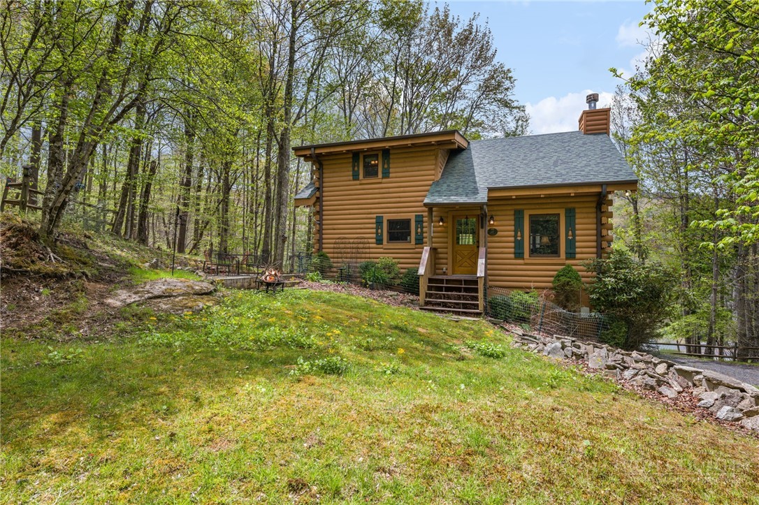 259 Greenbriar Road Beech Mountain, NC 28604 - Photo 2 of 41 front view of a house with a yard