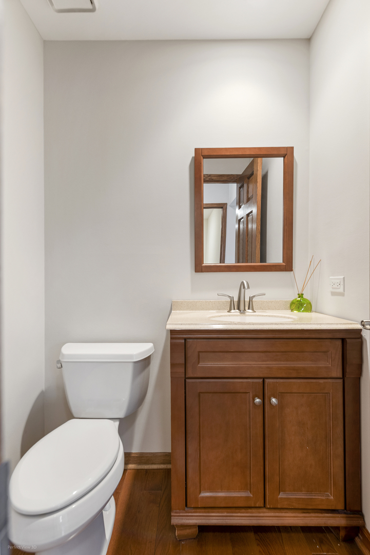 92 Foxboro Lane Gurnee, IL 60031 - Photo 14 of 46 a bathroom with a toilet a sink and mirror