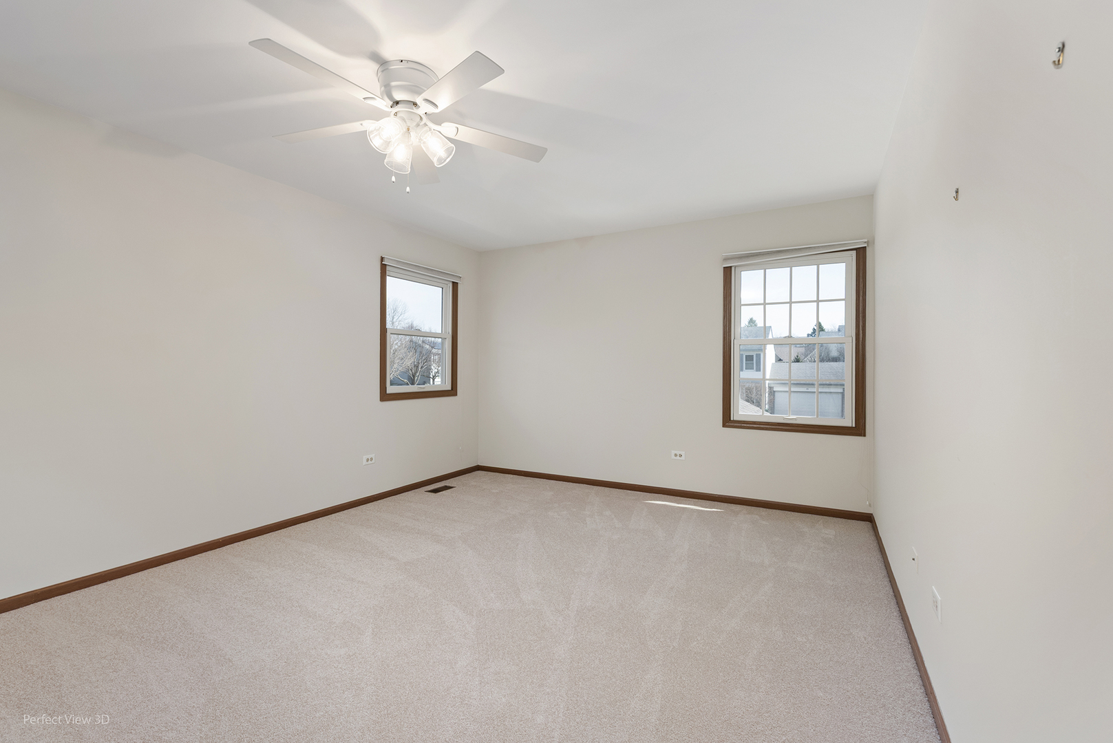 92 Foxboro Lane Gurnee, IL 60031 - Photo 16 of 46 an empty room with windows and chandelier fan
