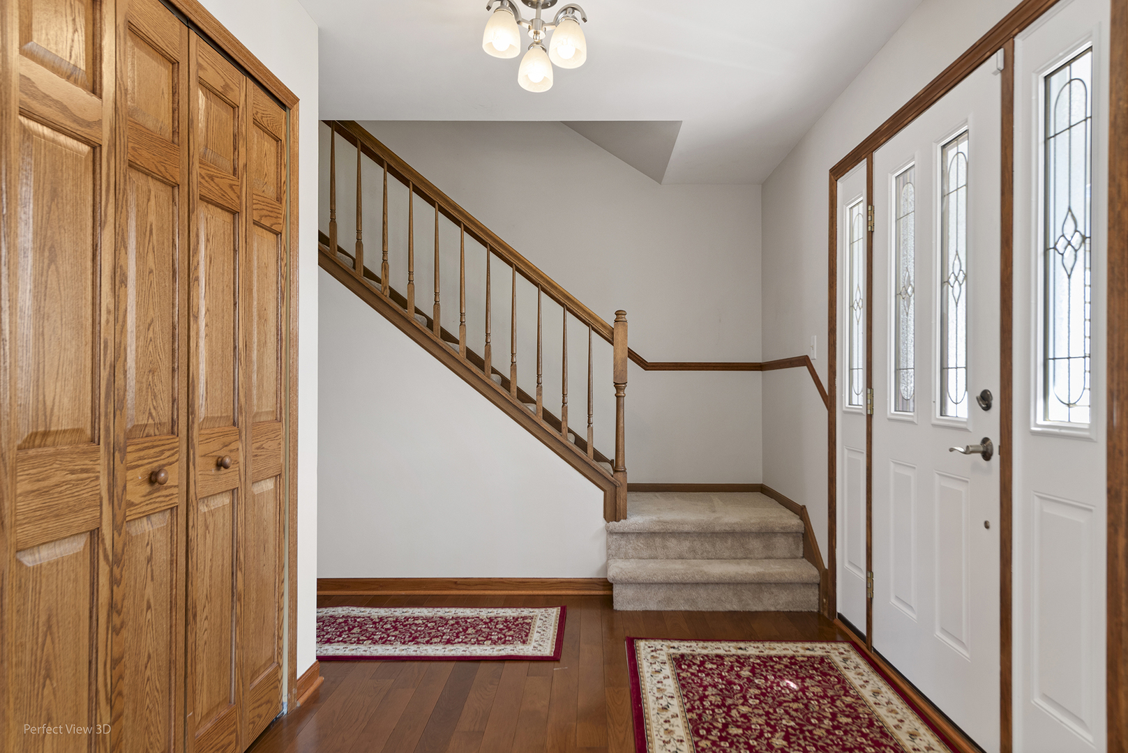 92 Foxboro Lane Gurnee, IL 60031 - Photo 2 of 46 a view of entryway with wooden floor and stairs