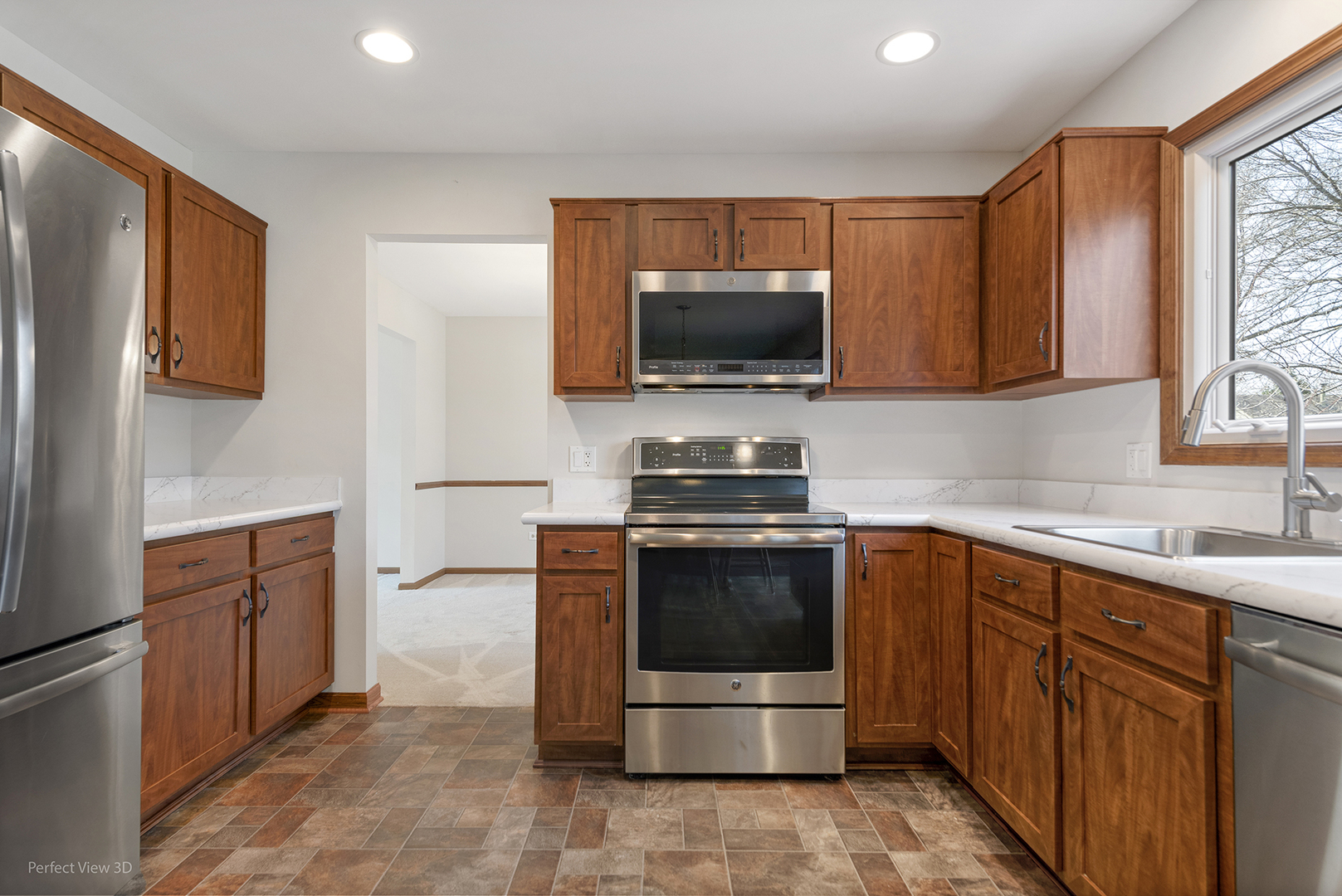 92 Foxboro Lane Gurnee, IL 60031 - Photo 9 of 46 a kitchen with stainless steel appliances a stove sink microwave and refrigerator