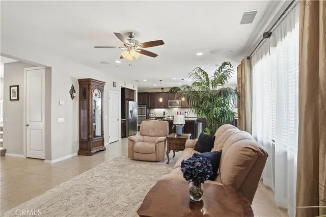 a large kitchen with lots of furniture a sink appliances and a dining table