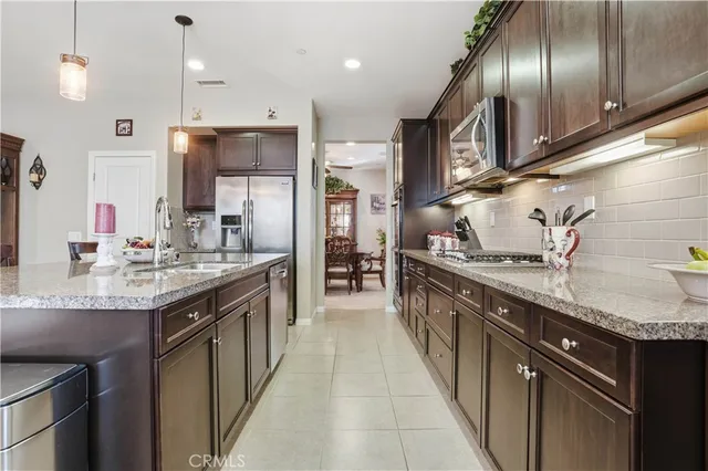 a bedroom with a bed lamp and a large window