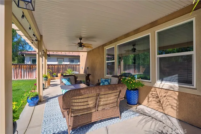 a view of a house with a yard porch and sitting area