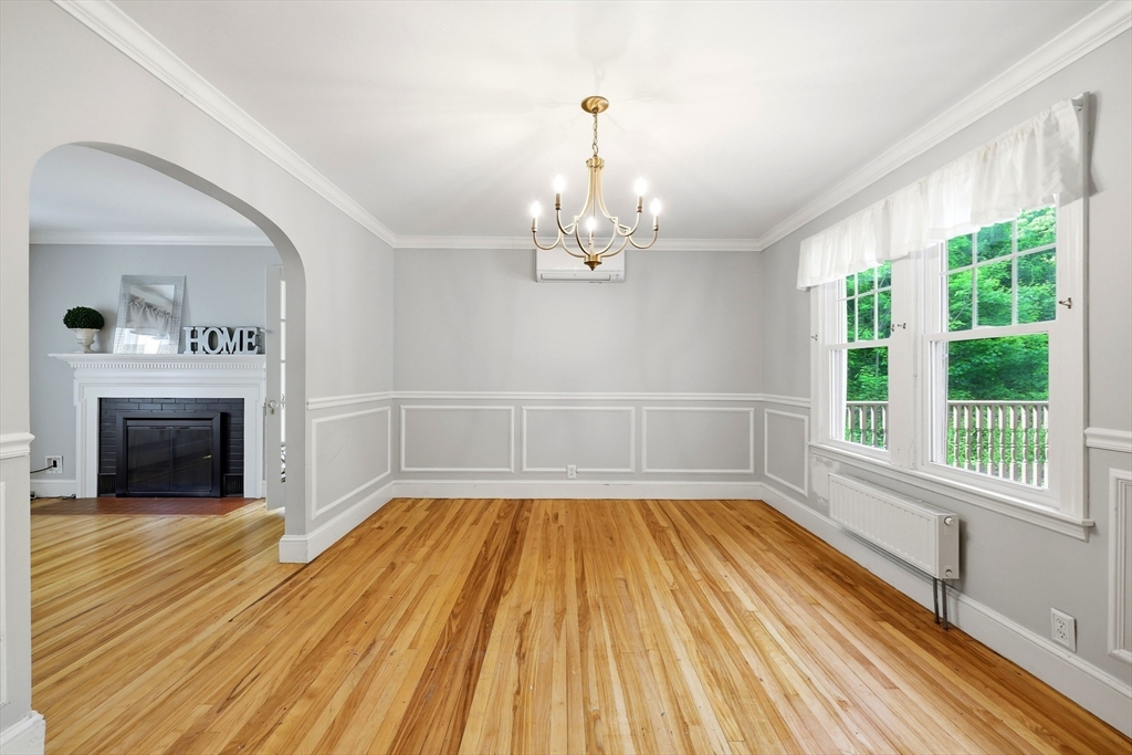 32 Lincoln Road Longmeadow, MA 01106 - Photo 11 of 36 a view of empty room with wooden floor and fireplace