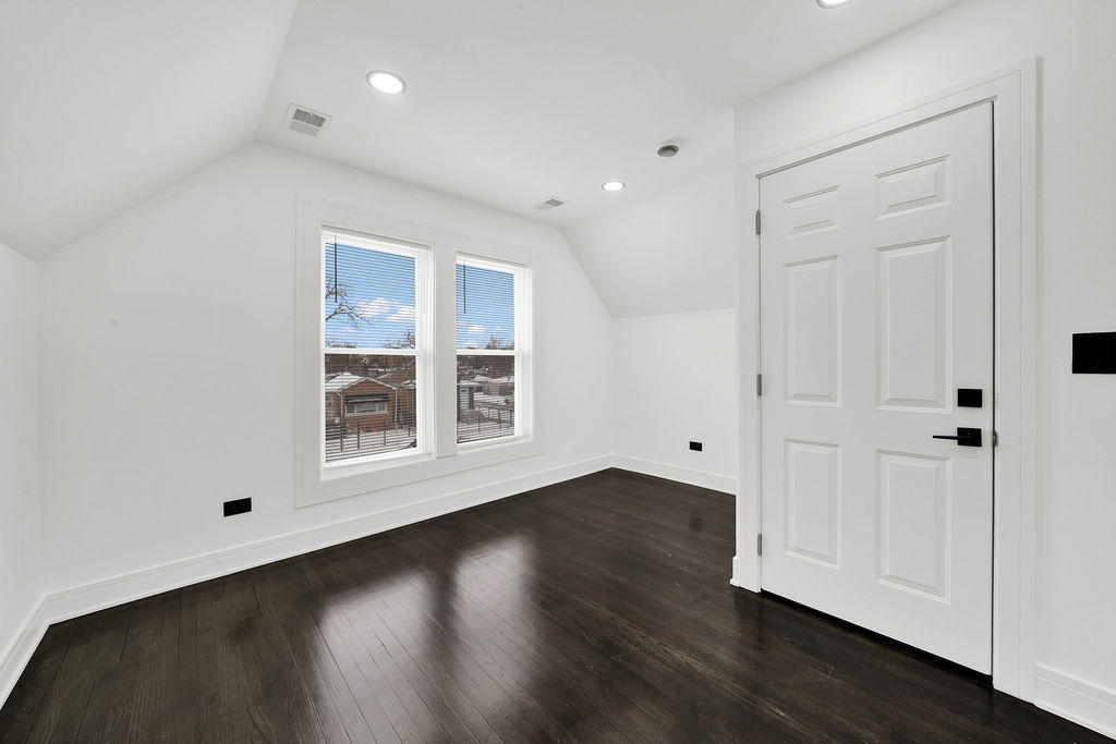 6607 South Oakley Avenue Chicago, IL 60636 - Photo 15 of 32 an empty room with wooden floor and windows