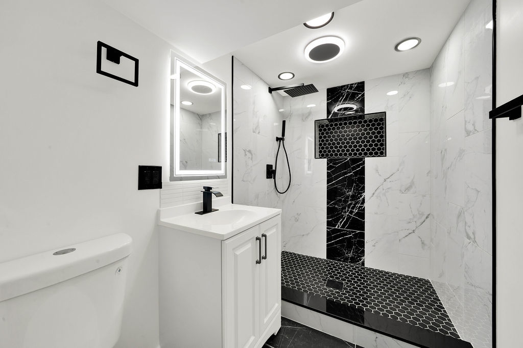 6607 South Oakley Avenue Chicago, IL 60636 - Photo 18 of 32 a bathroom with a sink a toilet and shower