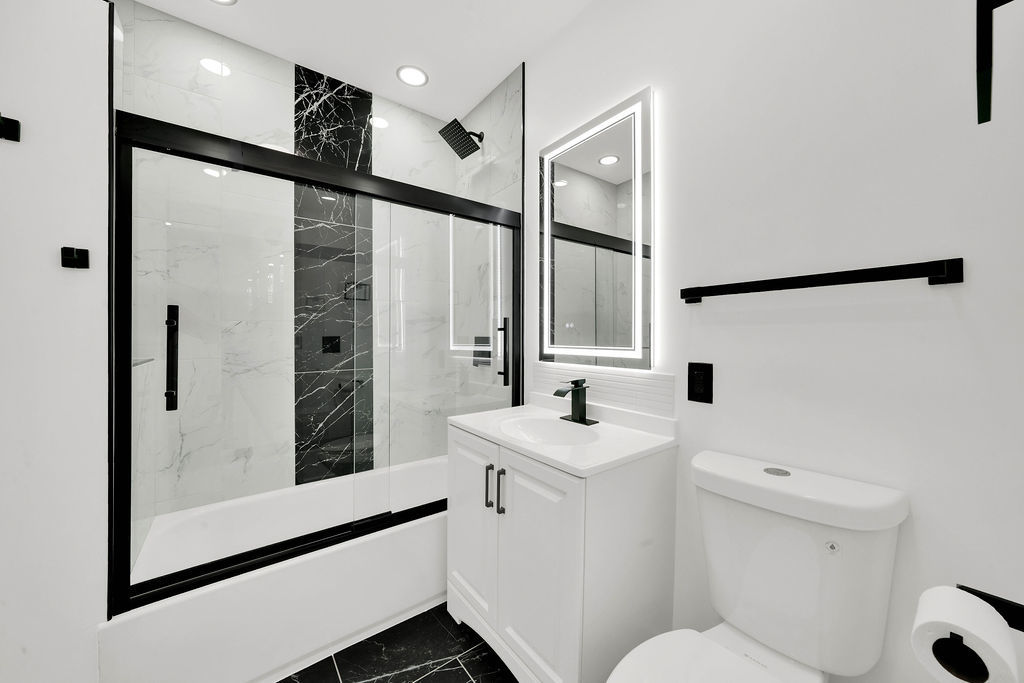 6607 South Oakley Avenue Chicago, IL 60636 - Photo 25 of 32 a bathroom with a sink a toilet and shower