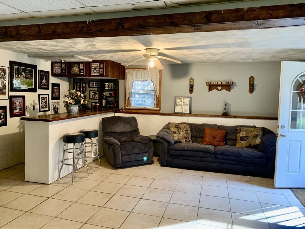 11 Hebert Road Spencer, MA 01562 - Photo 17 of 29 a living room with furniture and a fireplace