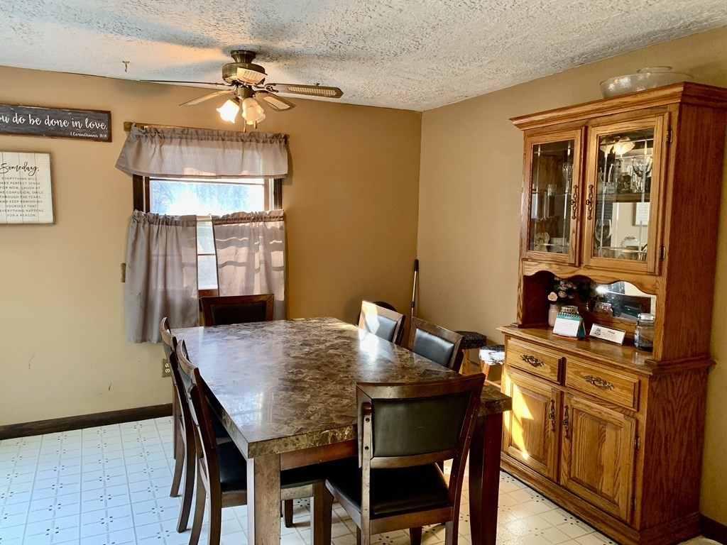 11 Hebert Road Spencer, MA 01562 - Photo 6 of 29 a view of a dining room with furniture and wooden floor