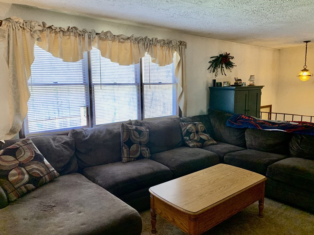 11 Hebert Road Spencer, MA 01562 - Photo 8 of 29 a living room with furniture and a couch