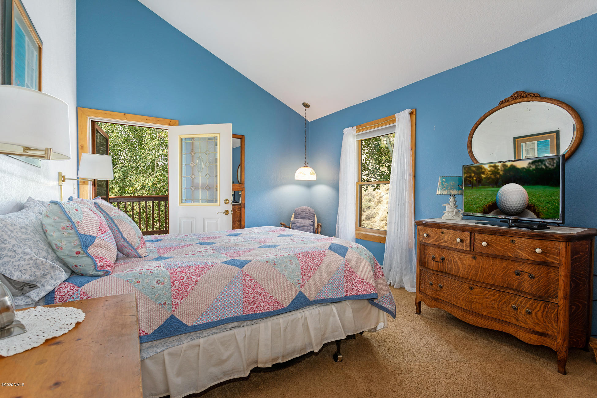 756 Eby Creek Road Eagle, CO 81631 - Photo 14 of 45 a bedroom with a bed and a dresser