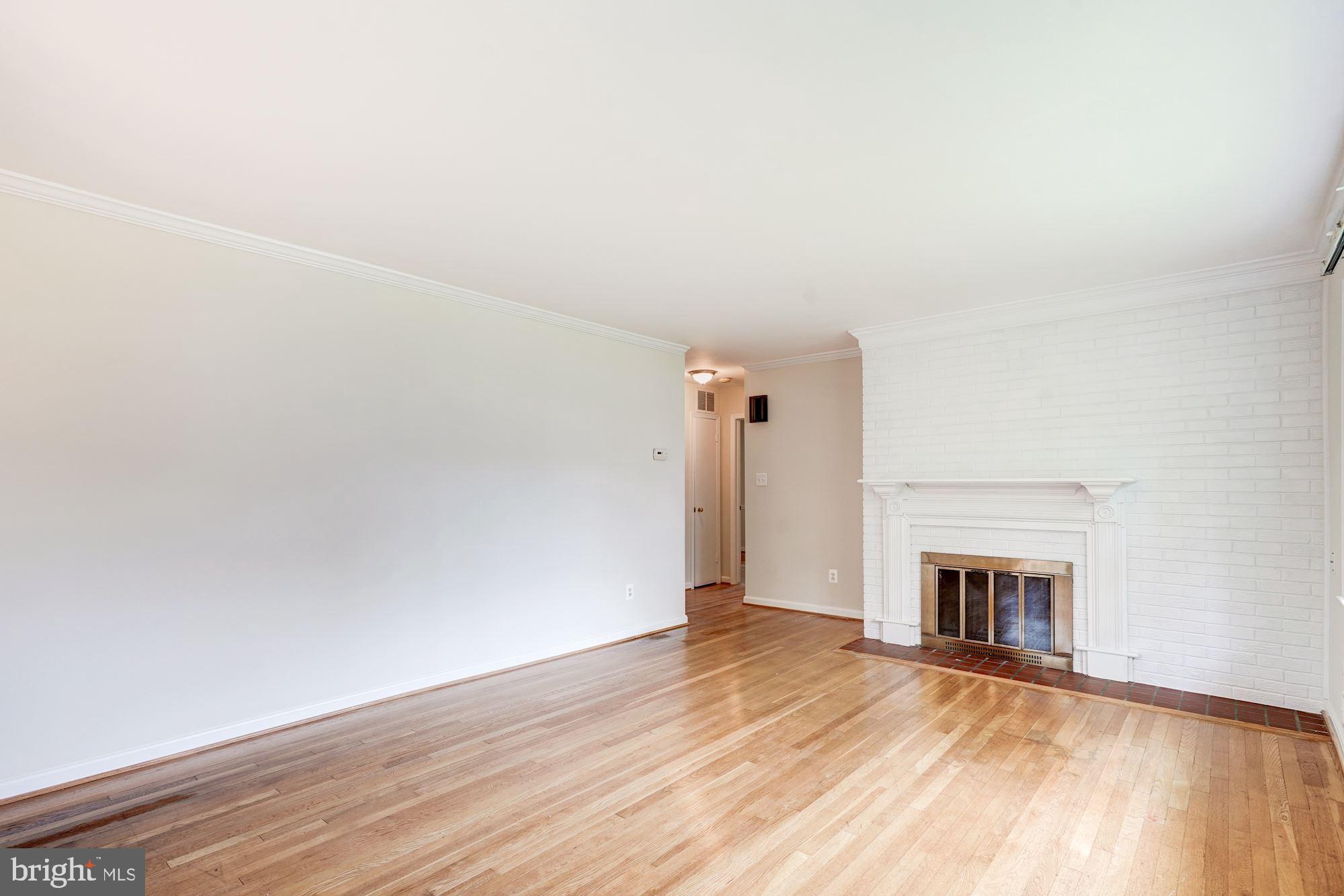 6800 Dean Drive McLean, VA 22101 - Photo 4 of 18 Freshly painted walls & wood burning fireplace