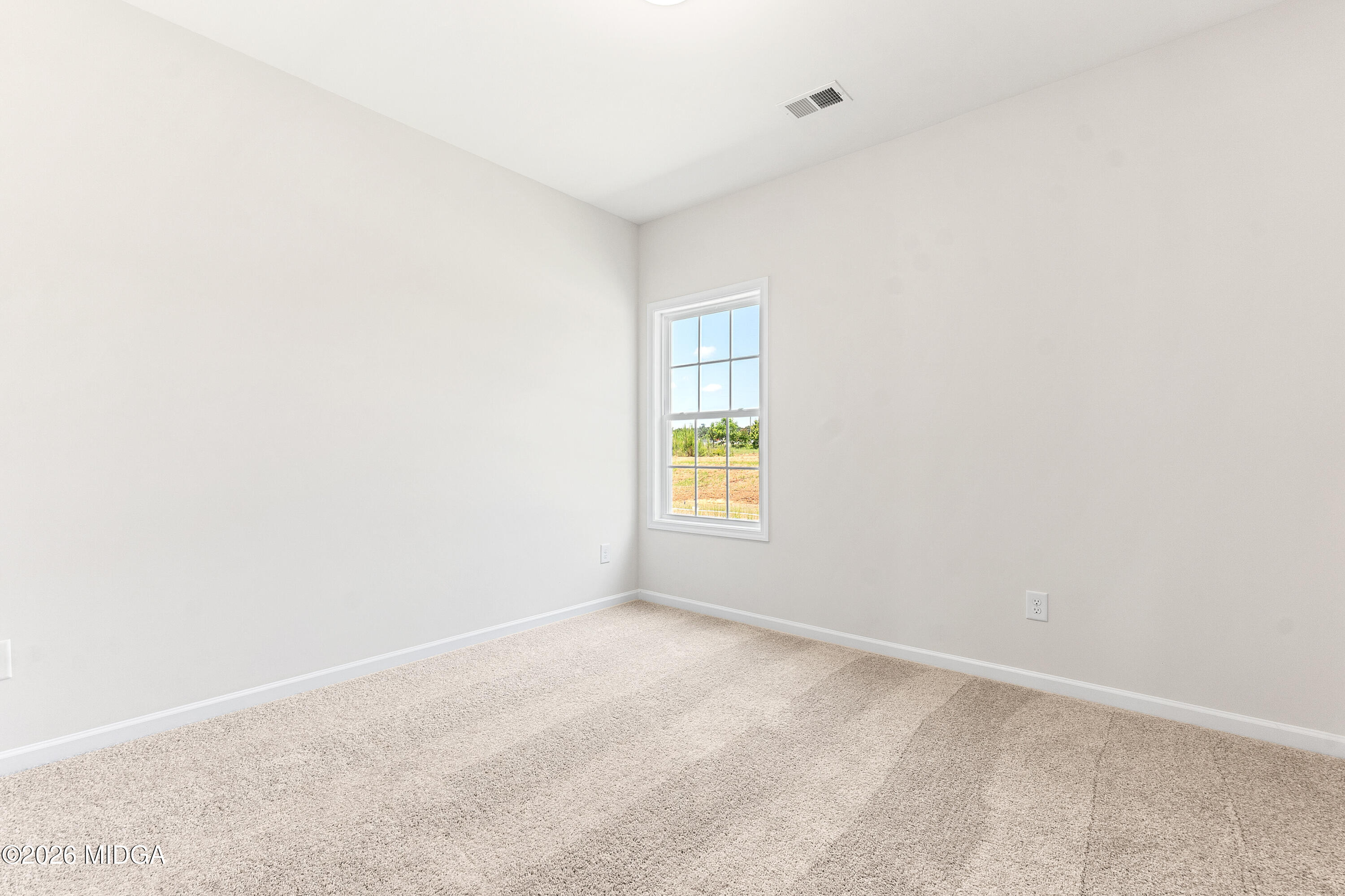 5393 Felles Way, Unit 359 Forsyth, GA 31029 - Photo 54 of 54 a view of an empty room with a window