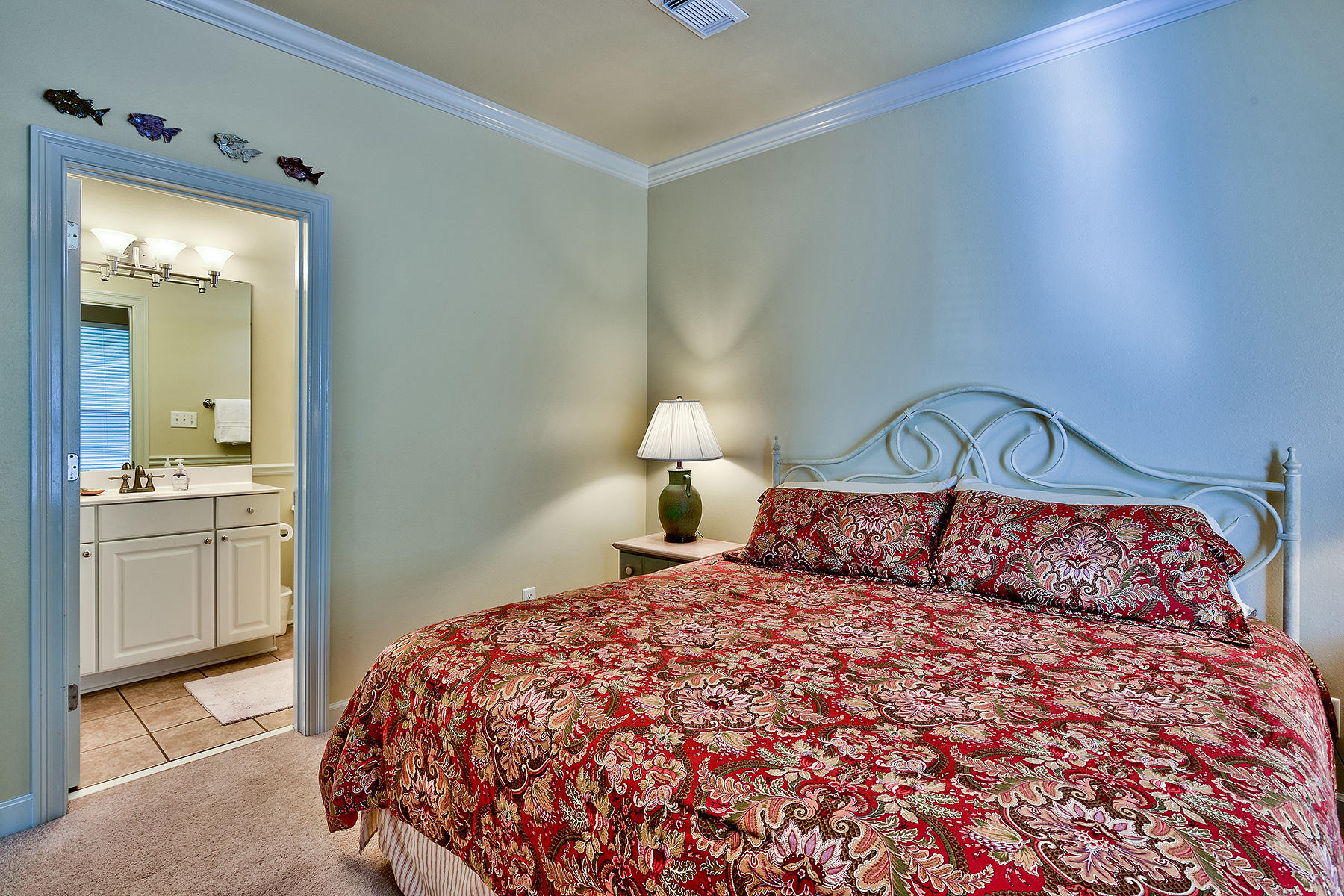 49 Cottage Street Santa Rosa Beach, FL 32459 - Photo 21 of 27 a bedroom with a bed and a mirror