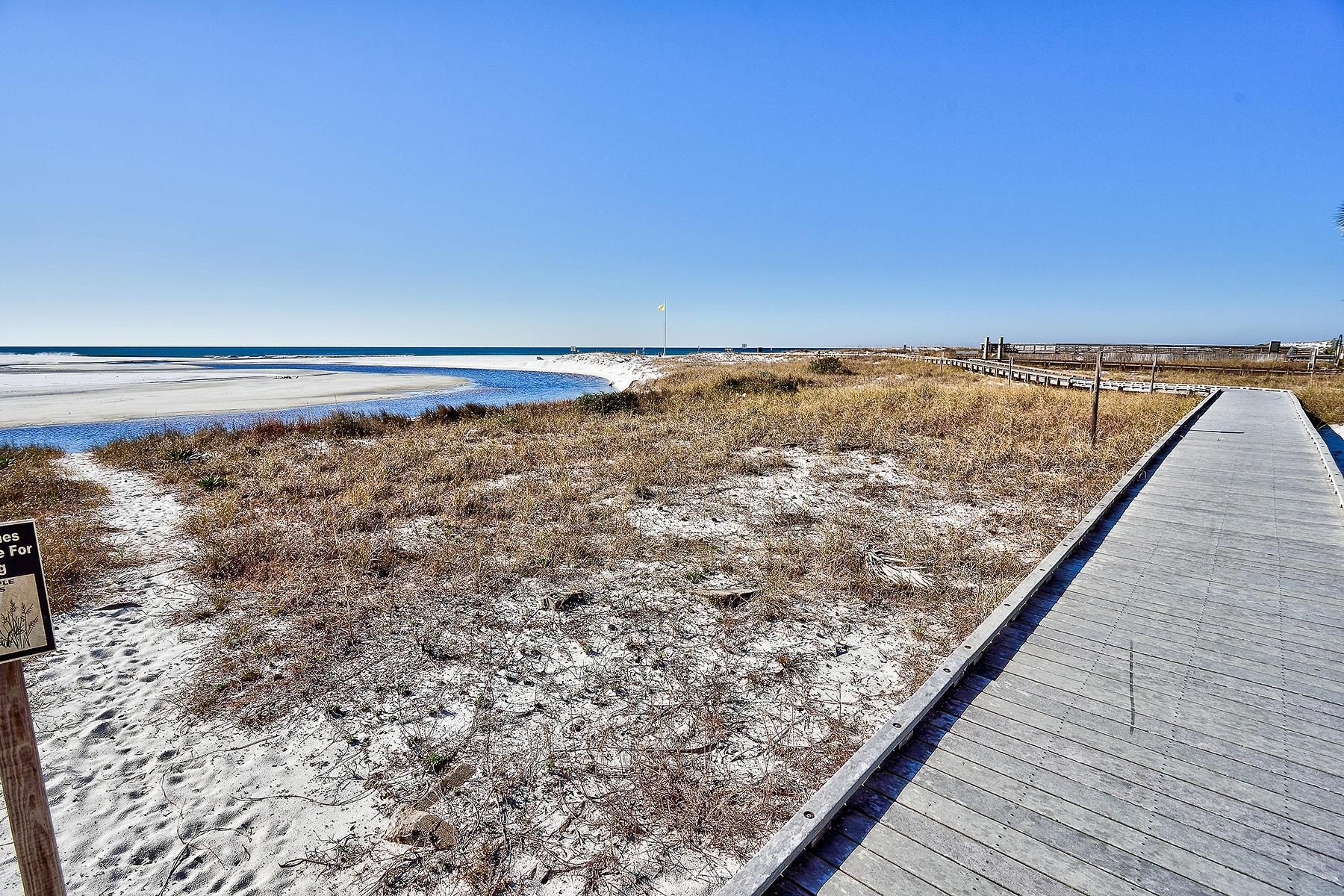 49 Cottage Street Santa Rosa Beach, FL 32459 - Photo 27 of 27 a view of a large body of water with a building in the background