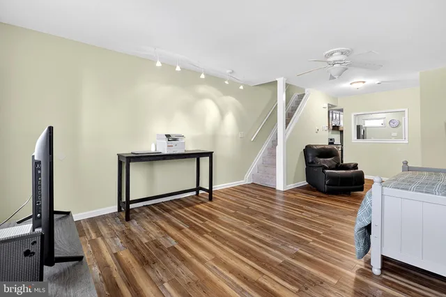 a bedroom with a bed and a flat screen television