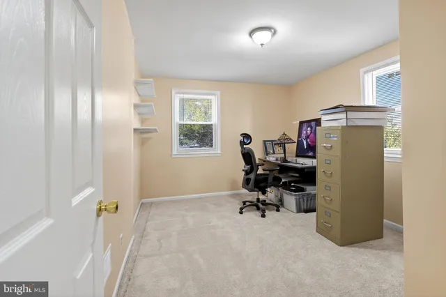 a view of a workspace with furniture