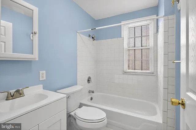 a brick building with a yard