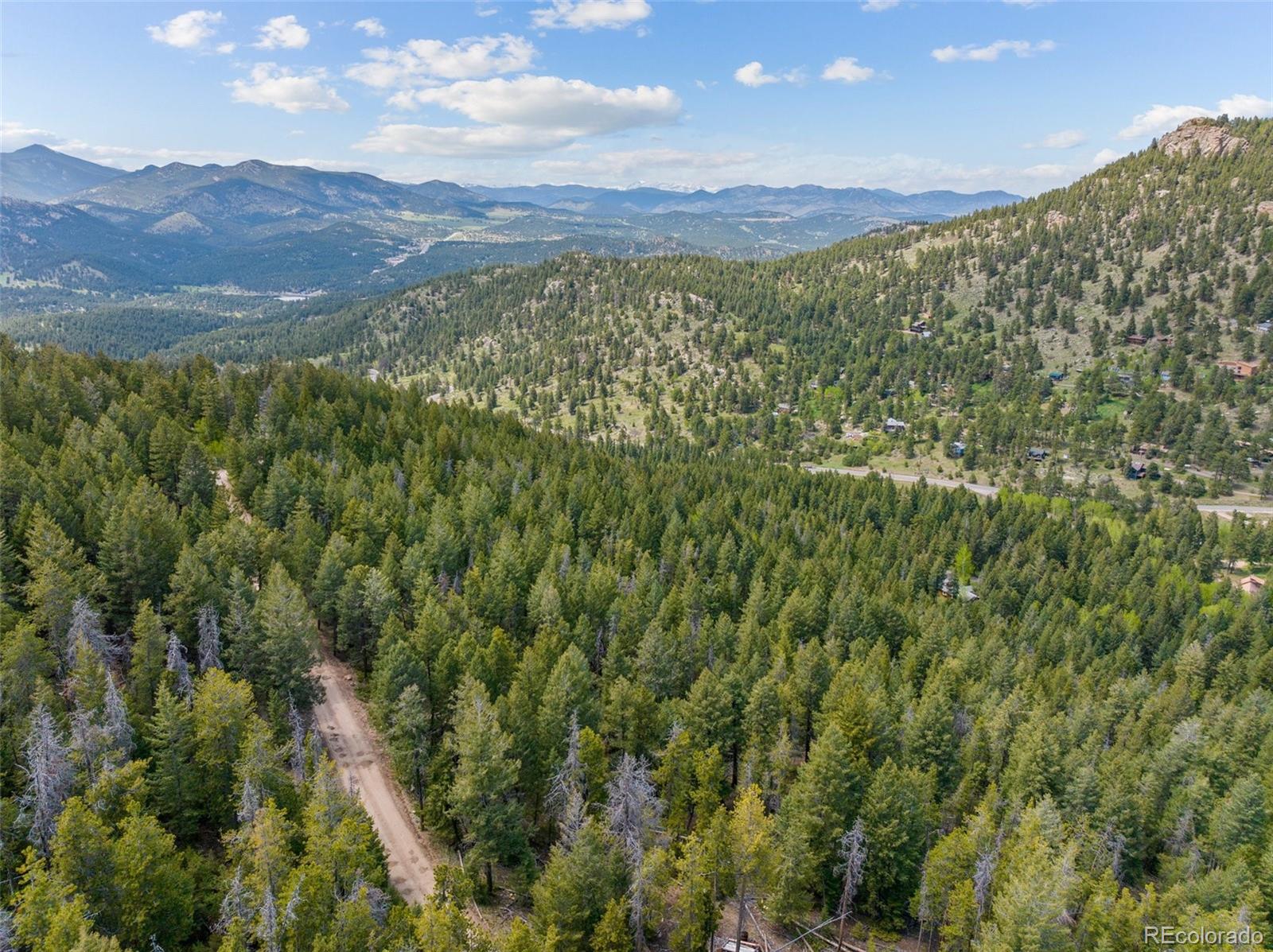 Lost Cabin Trail Evergreen, CO 80439 - Photo 11 of 17 a view of a city with mountains in the background