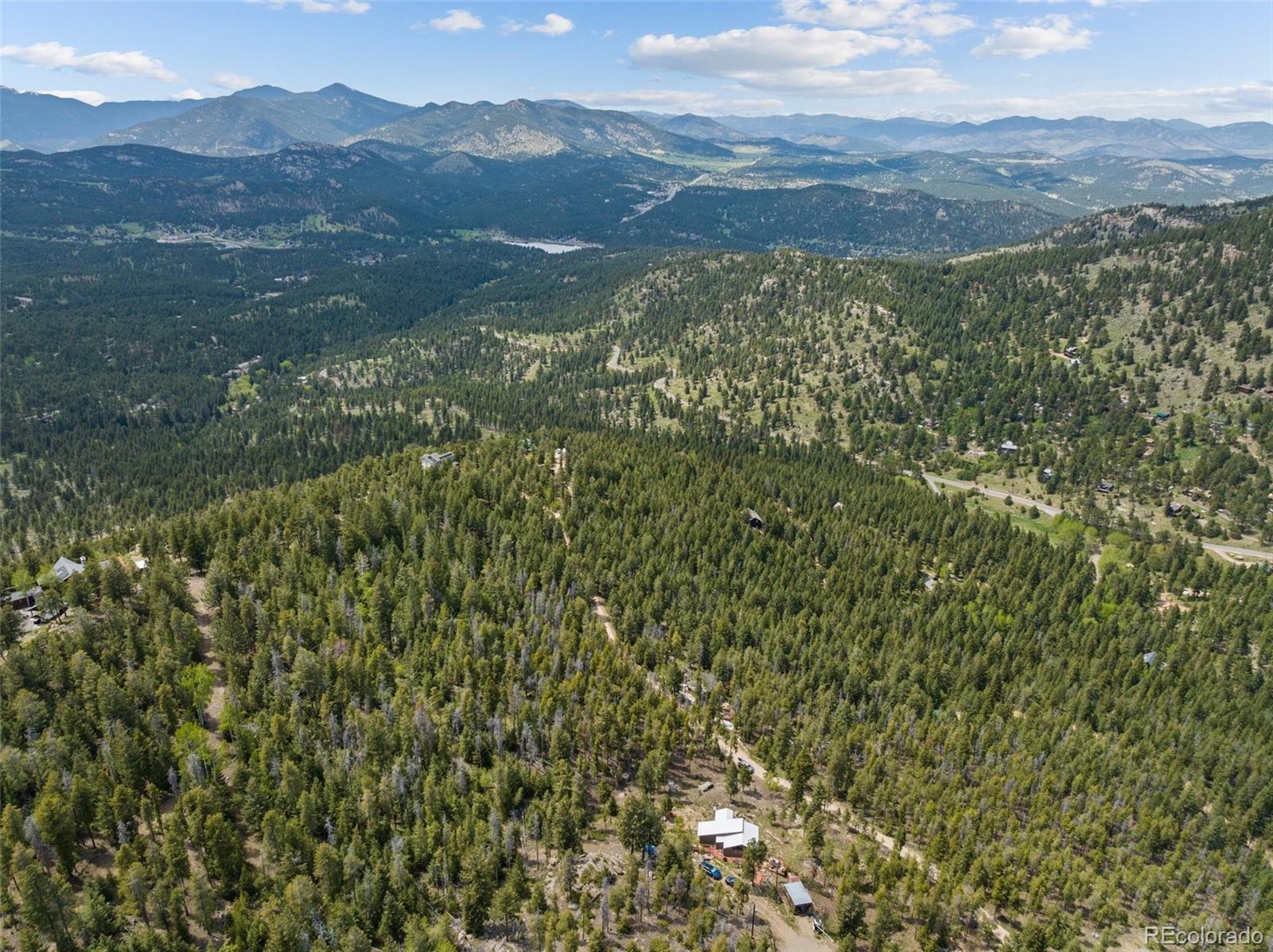 Lost Cabin Trail Evergreen, CO 80439 - Photo 2 of 17 a view of a mountain range with lush green forest