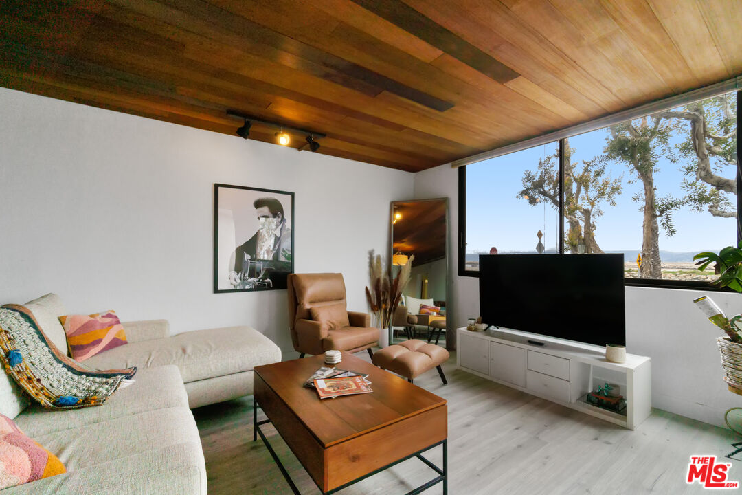 6209 Pacific Avenue, Unit 103 Playa del Rey, CA 90293 - Photo 7 of 40 a living room with furniture and a flat screen tv