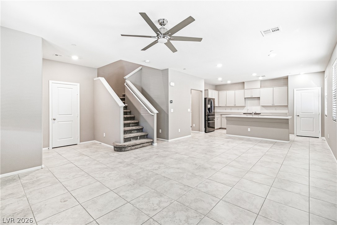 2834 Turnstone Ridge Street Henderson, NV 89044 - Photo 21 of 22 An open floor plan seamlessly connects the tiled living space with the kitchen area.