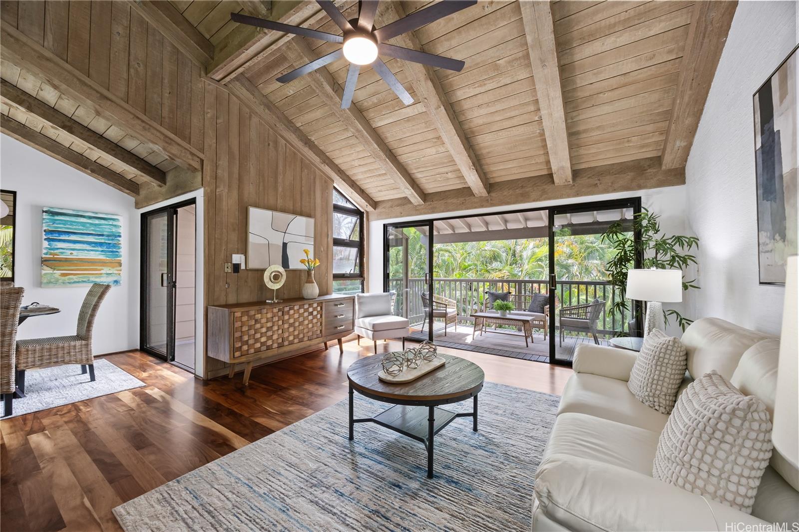 45-995 Wailele Road, Unit 35 Kaneohe, HI 96744 - Photo 6 of 25 Vaulted ceilings and koa floors adorn your living room which flows to your covered lanais