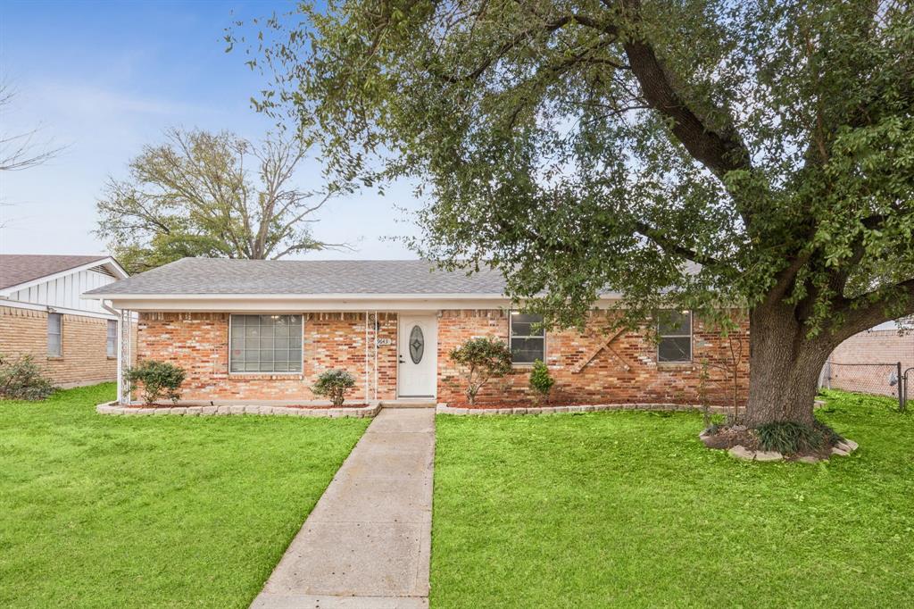 9643 Altacrest Drive Dallas, TX 75227 - Photo 2 of 30 a front view of a house with garden