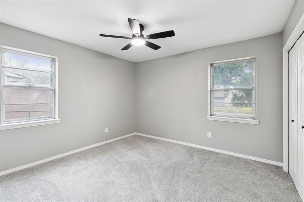 9643 Altacrest Drive Dallas, TX 75227 - Photo 21 of 30 a view of an empty room with a window