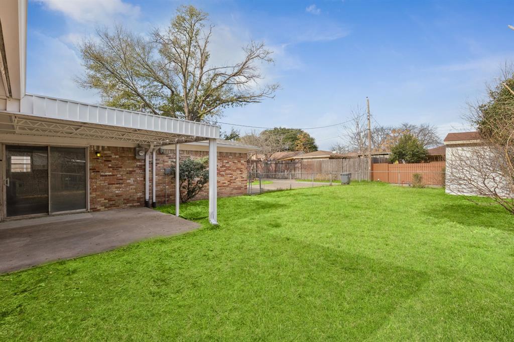 9643 Altacrest Drive Dallas, TX 75227 - Photo 27 of 30 a view of a house with a yard and sitting area