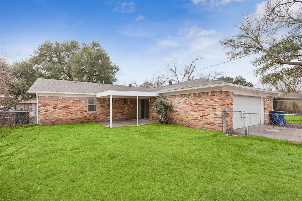 9643 Altacrest Drive Dallas, TX 75227 - Photo 28 of 30 a view of a house with a yard and sitting area
