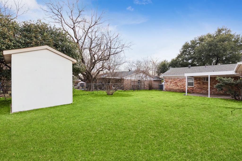 9643 Altacrest Drive Dallas, TX 75227 - Photo 29 of 30 a view of a backyard with large trees